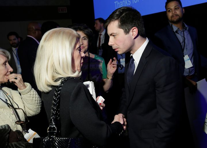 Pete Buttigieg speaks to a supporter after a Democratic National Committee forum in Baltimore on Feb. 11, 2017.