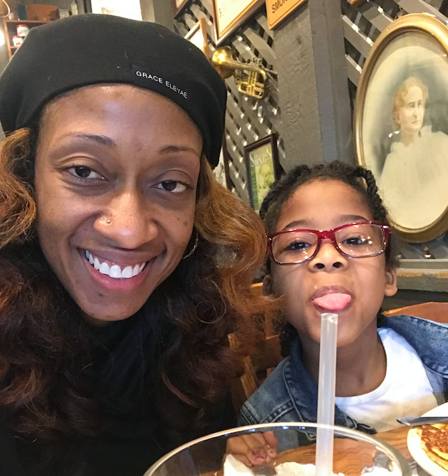 Marissa Alexander eats breakfast with her daughter Rihanna on her first day off house arrest. 