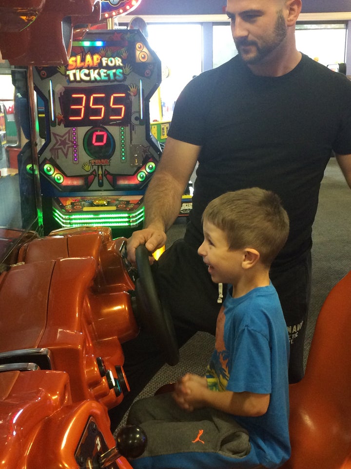 Mike Moniz and his son, Austin, at a Chuck E. Cheese's Sensory Sensitive Sundays event.