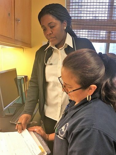 VNSNY Hospice Nurse, Claudia Paul, supervises a colleague at VNSNY’s Shirley Goodman and Himan Brown Residence. 