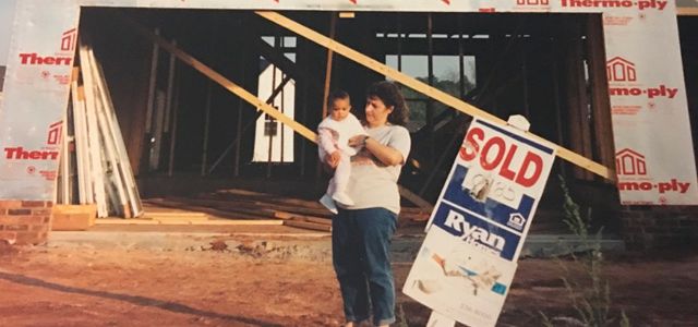 My mother holding me at six months old, right before our house was finished in 1994. We lost the house in 2001. My parents remain unable to find affordable and stable housing to this day.