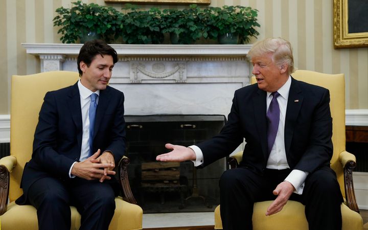 Canadian Prime Minister Justin Trudeau (L) meets with U.S. President Donald Trump in the Oval Office at the White House.