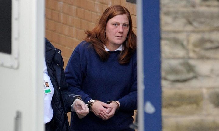 Karen Matthews is led from Dewsbury police station, before her court appearance in connection with the abduction of her daughter in 2008