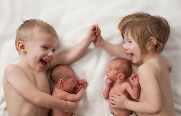 After letting the older kids take off their "fancy" clothes, she captured this joy-filled sibling photo.