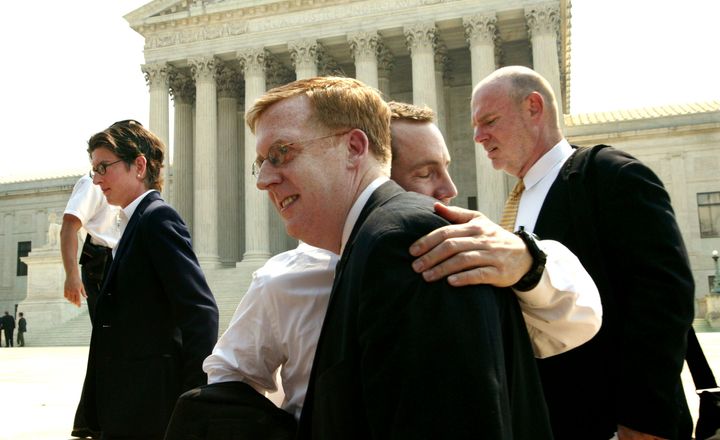 Bill Hohengarten and Paul Smith, attorneys for plaintiffs John Lawrence and Tyron Garner, hug outside the U.S. Supreme Court building June 26, 2003 in Washington, D.C. after the Court struck down sodomy laws that make it a crime for persons of the same sex to engage in sexual relations.