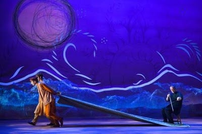 David Coulter (right) performing on a musical saw during the opening sequence of A Thousand Splendid Suns 