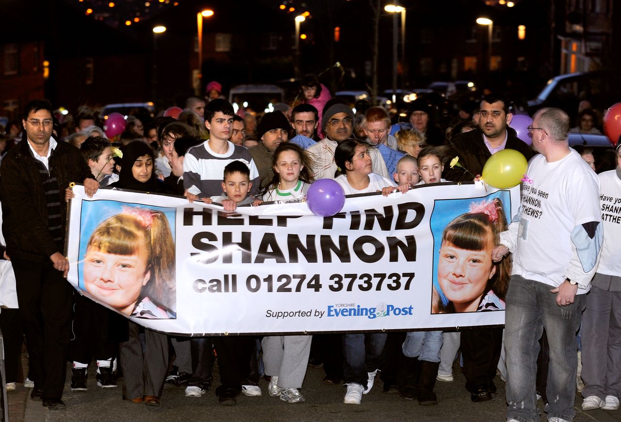 Supporters and family members of missing nine year old Shannon Matthews walk around Dewsbury in this undated photo from 2008. Councillor Hussain is on the far left