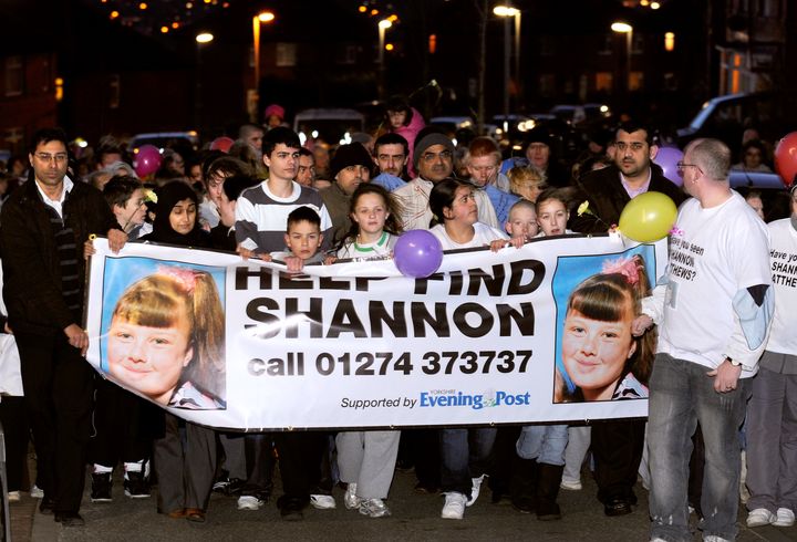 Supporters and family members of missing nine year old Shannon Matthews walk around Dewsbury in this undated photo from 2008