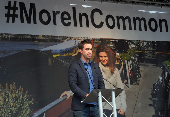 Brendan Cox, the husband of murdered Labour Party MP Jo Cox,(pictured behind him) speaks during a special service at Trafalgar Square in London in June