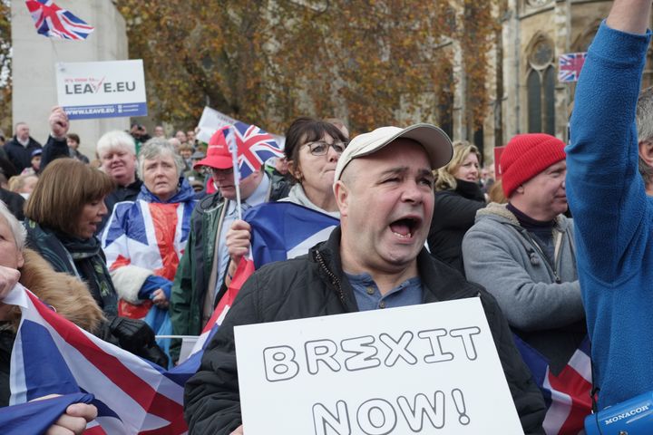 A pro-Brexit demonstrator chants during a protest outside the Houses of Parliament