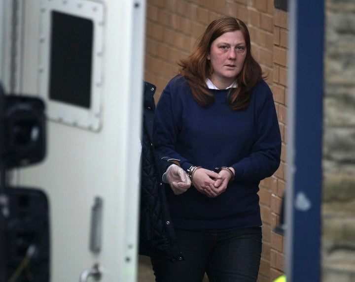 A handcuffed Karen Matthews, the mother of Shannon Matthews, leaves Dewsbury Police Station today to appear at court charged with perverting the course of justice and child neglect on April 9, 2008