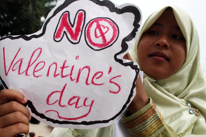 Muslim activists hold posters as they support a ban on Valentine's Day on Feb. 14, 2016 in Medan, Indonesia.