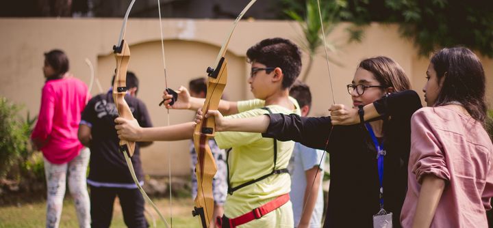 <p>Students at Edopia prepare for an archery lesson.</p>