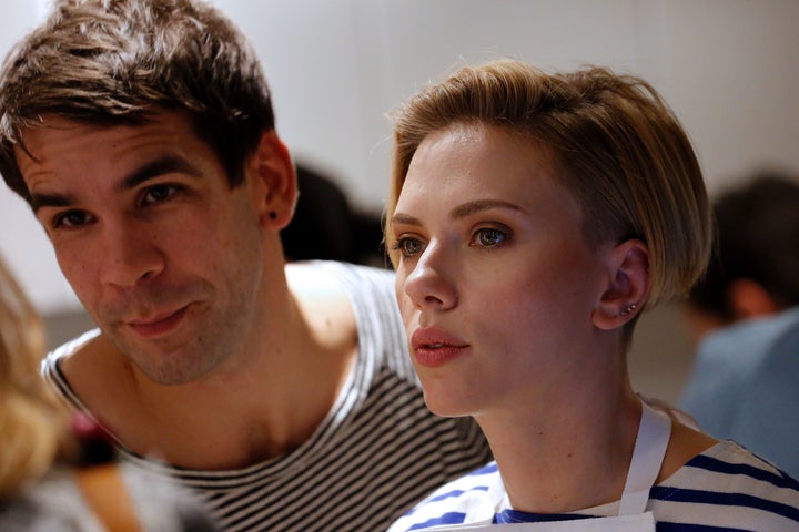 Scarlett Johansson and Romain Dauriac at the opening of the Yummy Pop gourmet popcorn shop in the Marais district of Paris on October 22, 2016.