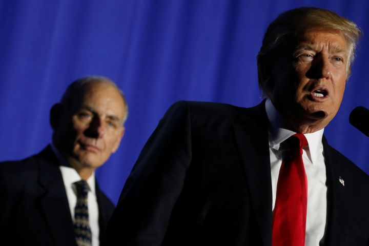 President Donald Trump, flanked by Homeland Security Secretary John Kelly, speaks at the department headquarters in January. He told employees they were "about to be very, very busy doing your job the way you want to do them."