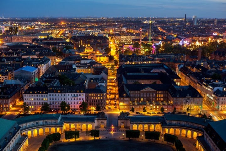 Nighttime cityscape of Copenhagen, Denmark, winner of numerous awards for livability, health, environmental achievement, and climate protection. 