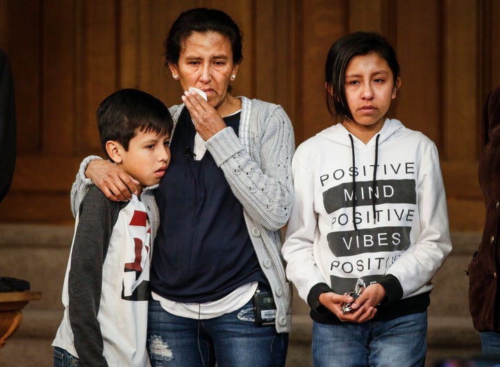 Vizguerra stands with her children Roberto, 10, and Luna Baez, 12, as she addresses supporters and the media at Denver's First Unitarian Church.