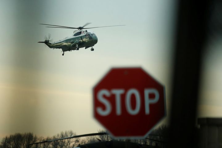 Donald Trump arrives aboard the Marine One to greet the remains of a US military commando killed during a raid on 1 February.