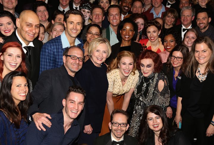 Hillary Clinton and Glenn Close pose with "Sunset Boulevard" cast and orchestra backstage.