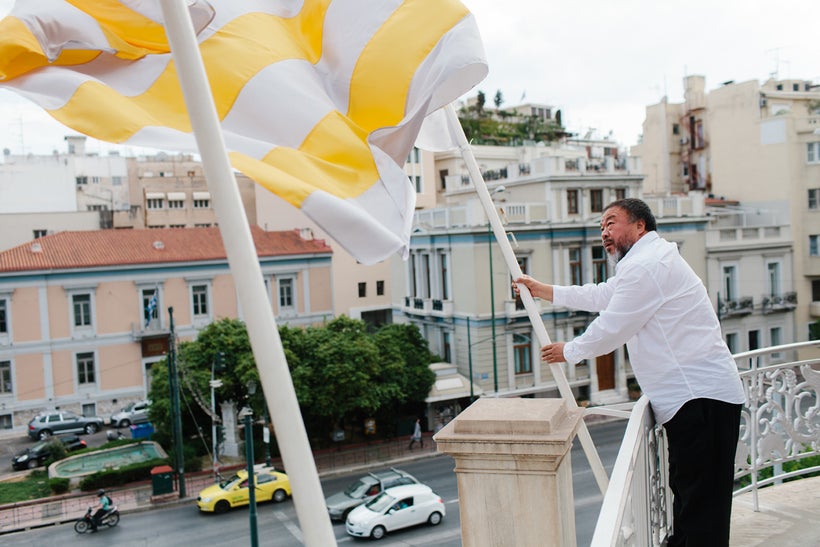 Ai Weiwei installing new work, <em>Flags {Europe, Shadow, Greece}</em> exterior to Stathatos Mansion. Photo: Paris Tavitian,