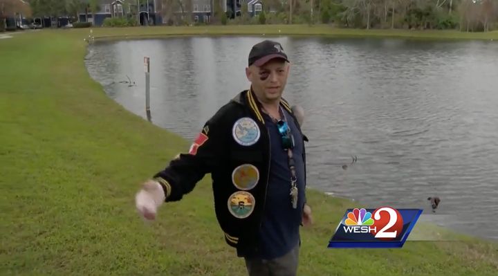 The 45-year-old Navy veteran stands near a Daytona Beach pond where he said three people violently killed a turtle.