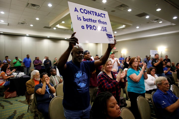 Leonard Smalls of The International Longshoremen's Association, shows his support during a rally held by The International As
