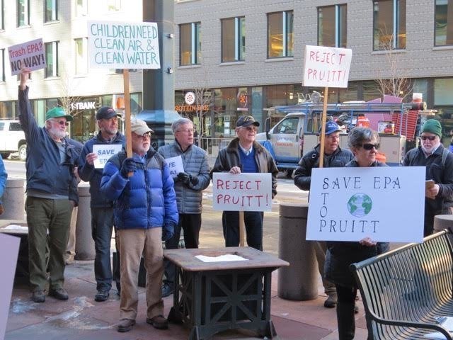  Former EPA Region 8 employees protest outside Sen. Michael Bennet's office. 