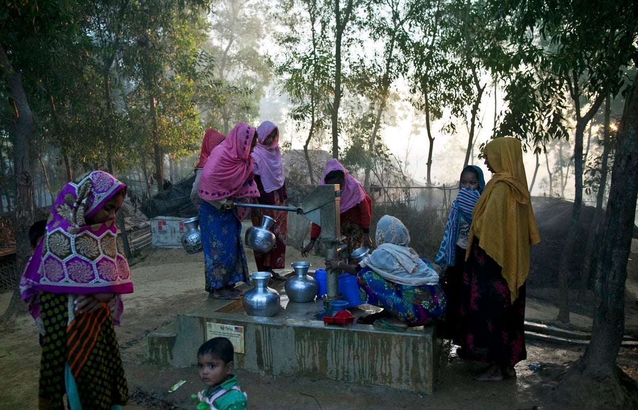 Refugees fetch water in Kutapalong.