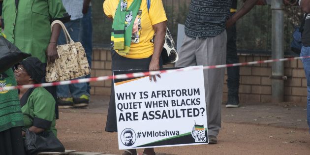 ANC supporters protest outside the Middelburg Magistrates Court during the appearance of Theo Jackson and Willem Oosthuizen, who are accused of assaulting and forcing Rethabile Victor Mlotshwa into a coffin on January 25, 2017 in Middelburg, South Africa.