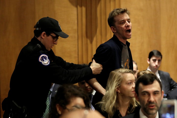 Police remove a protester during the Senate Foreign Relations Committee hearing on David Friedman's nomination.