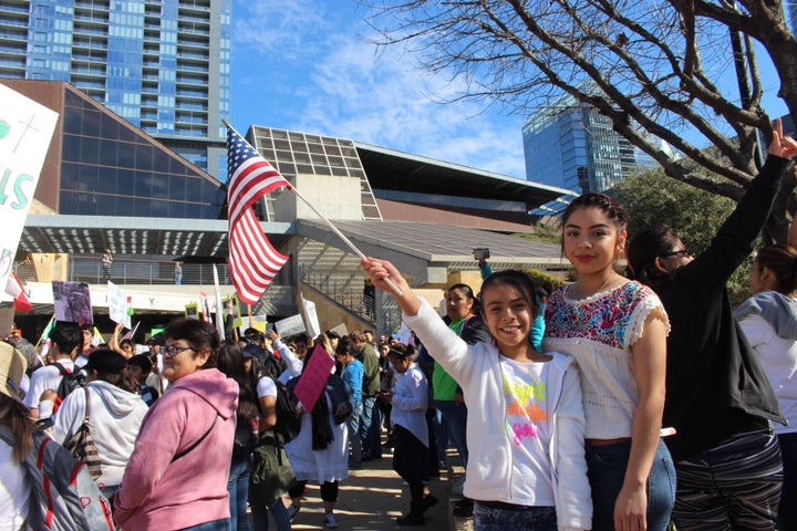 Noemí, 17, waved an American flag with her younger sister in front of Austin City Hall on Feb. 16, 2017, at a demonstration to support immigrants targeted by President Donald Trump's immigration crackdown.