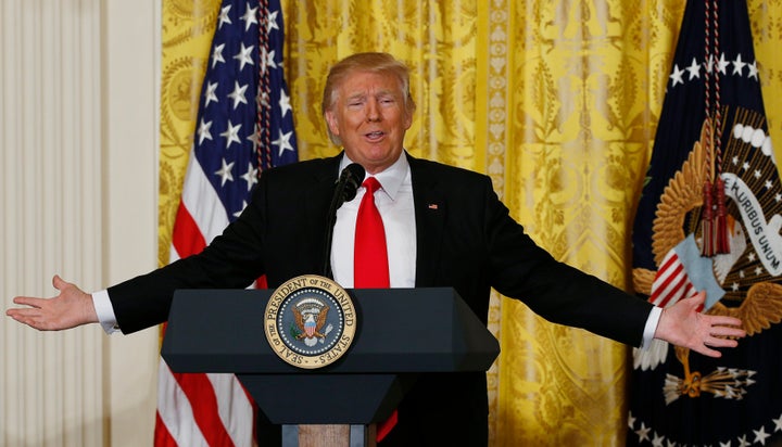 President Donald Trump reacts to a question during a news conference at the White House on Feb. 16.