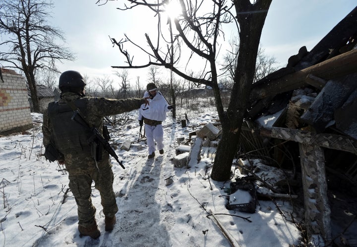 Ukrainian servicemen gather at their position on the front line near the government-held town of Avdiyivka, Ukraine, on Feb. 10.