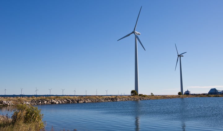 Two of seven older 600 MW Bonus wind turbines on Lynetten in the Copenhagen harbor. In the background are some of the 20 2 MW Bonus Turbines located in the Middlegrunden wind project near the Copenhagen coast