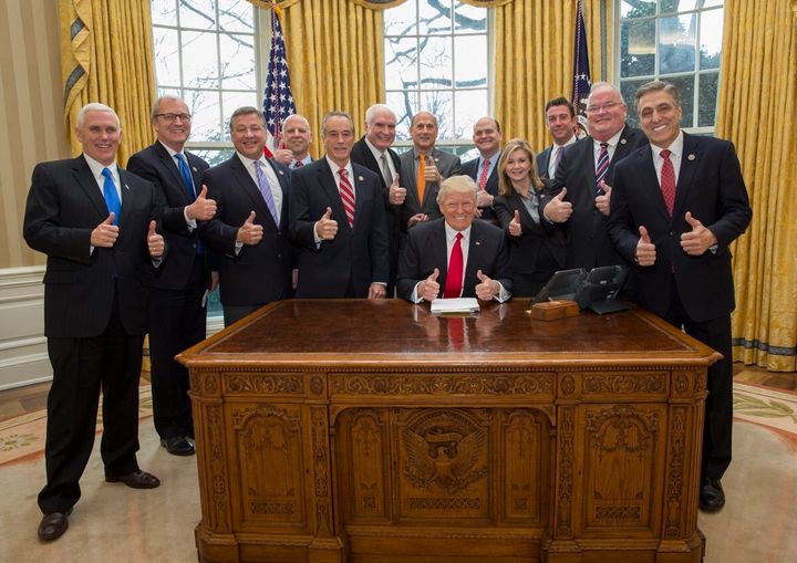 President Donald Trump poses with Vice President Mike Pence and the self-proclaimed "Trump caucus."