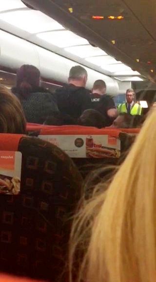 The women were escorted off the plane by the police after it landed at Stansted Airport 