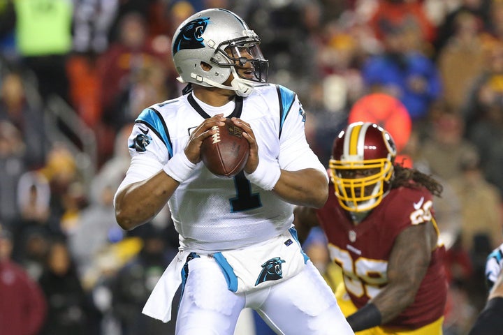 Jean Francois eyes 2015 NFL MVP Cam Newton during a game last season.