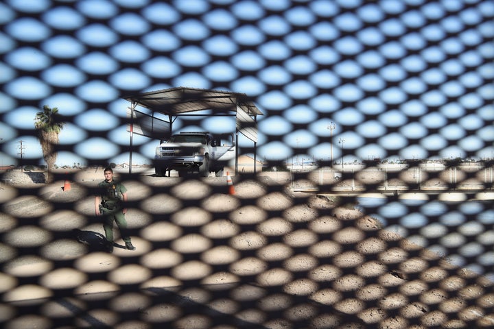 A U.S. Border Patrol agent stands at the U.S.-Mexico border fence on November 17, 2016 at San Luis, Arizona. Border prot