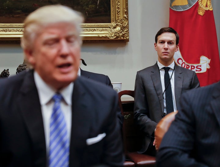 Kushner listens as Trump speaks during a breakfast with business leaders in the Roosevelt Room of the White House.