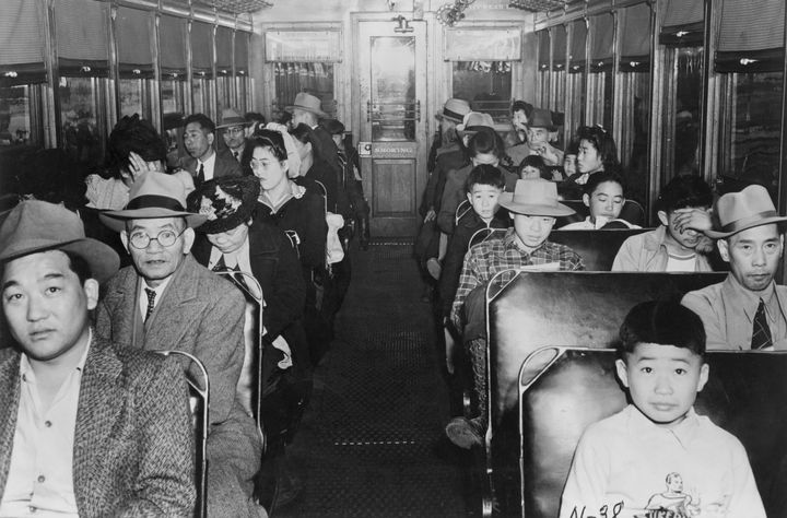 (Original Caption) 1942-Internment of Japanese-Americans during WWII: 'Evacuation' of the Niseis from California: Interior scene in an electric train en route to the assembly center.