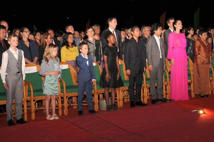 Angelina Jolie and her children listen to the Cambodian national anthem during the premiere of Jolie's new film