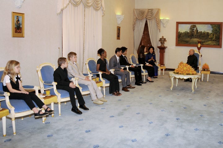 Angelina Jolie's children look on as their mother attends an audience with Cambodian King Norodom Sihamoni at the royal residence in Siem Reap on Feb. 18.