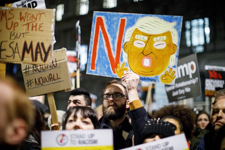 People protest against the U.S. travel and immigration ban from seven Muslim-majority countries and demand President Donald Trump's planned state visit to the UK to be canceled outside Downing Street in London on Jan. 30.