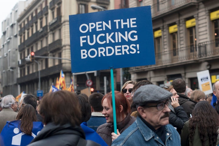 A woman marches in the pro-refugee demonstration in Barcelona on Saturday.