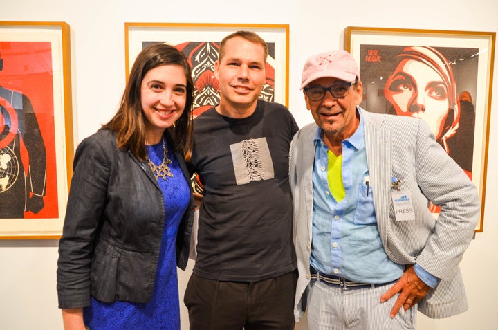 Shepard Fairey pictured at Art Wynwood after his lecture, with Sarah Cascone, Associate Editor, artnet News (left) and Bruce Helander (right). Photograph Jessica Rivas.