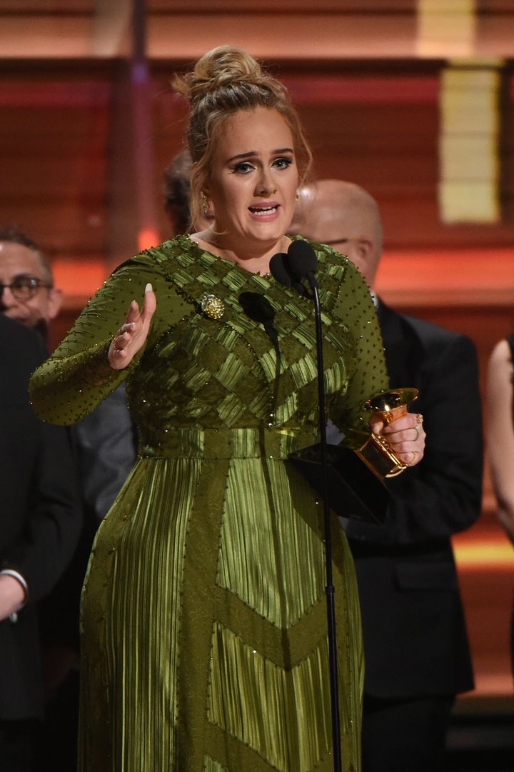 Adele addresses the audience at the Grammys