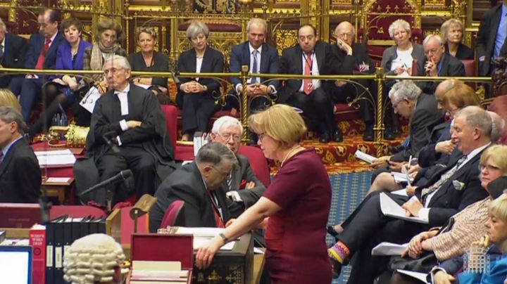 Theresa May sits on the steps of the throne in the House of Lords to watch the opening of the Brexit Bill debate