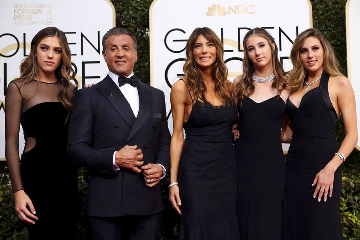 Actor Sylvester Stallone poses with his wife Jennifer Flavin (C), and their daughters, Sistine Stallone (L), Scarlet Stallone (2nd R) and Sophia Stallone during the 74th Annual Golden Globe Awards. 