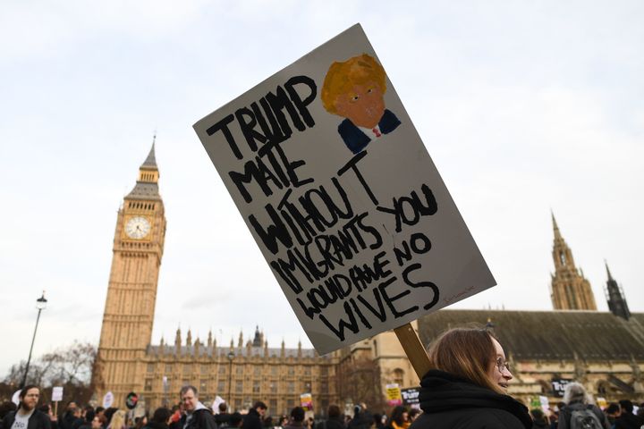 A Protester holds up an anti-Trump placard in front of the Elizabeth Tower, better known as 'Big Ben'