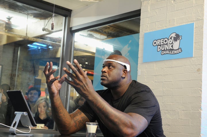 Shaq concentrating on his Oreo cookie. 